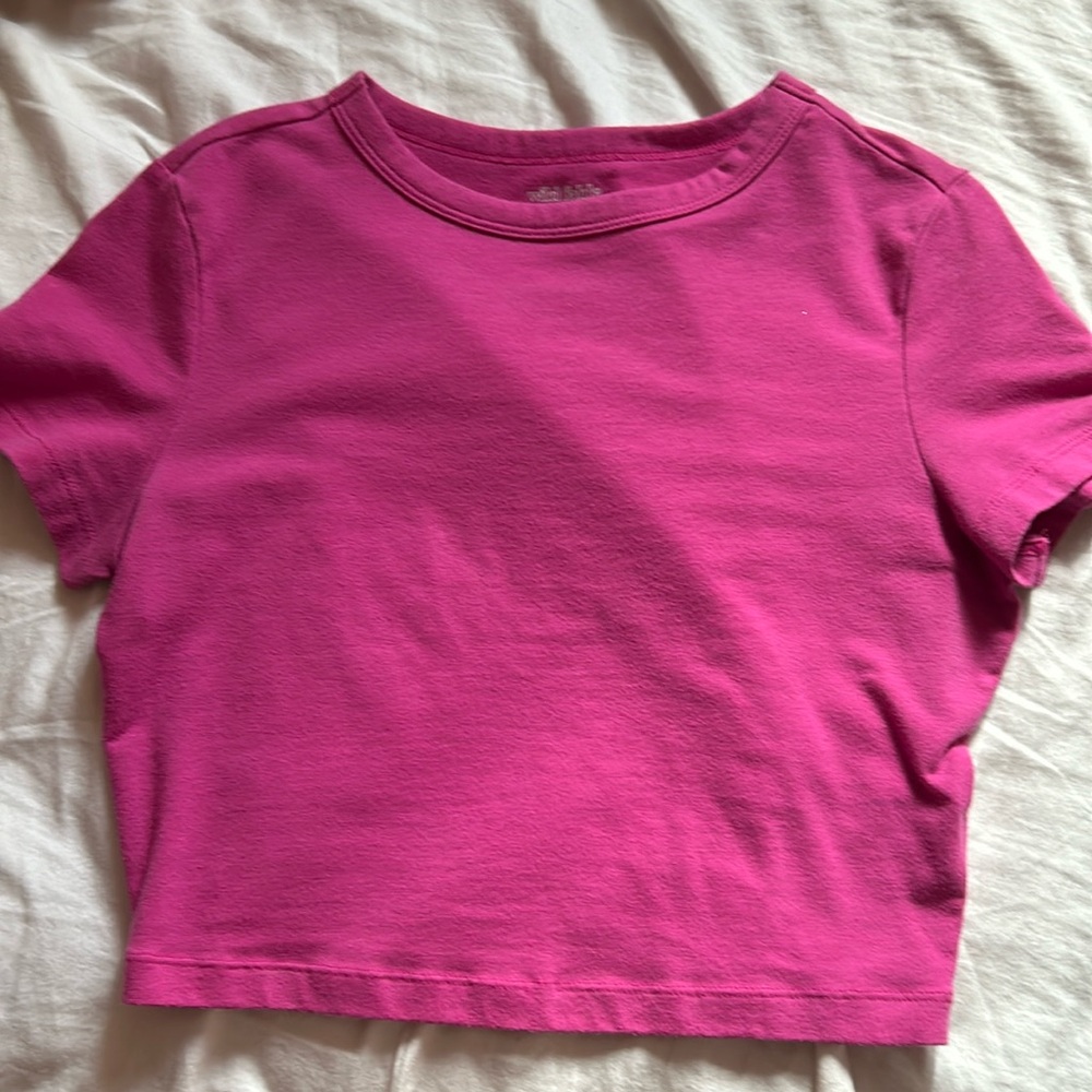 Pink crop top.